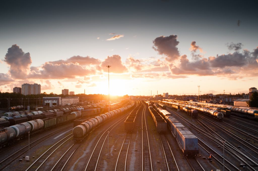 Dawn breaking over a rail yard